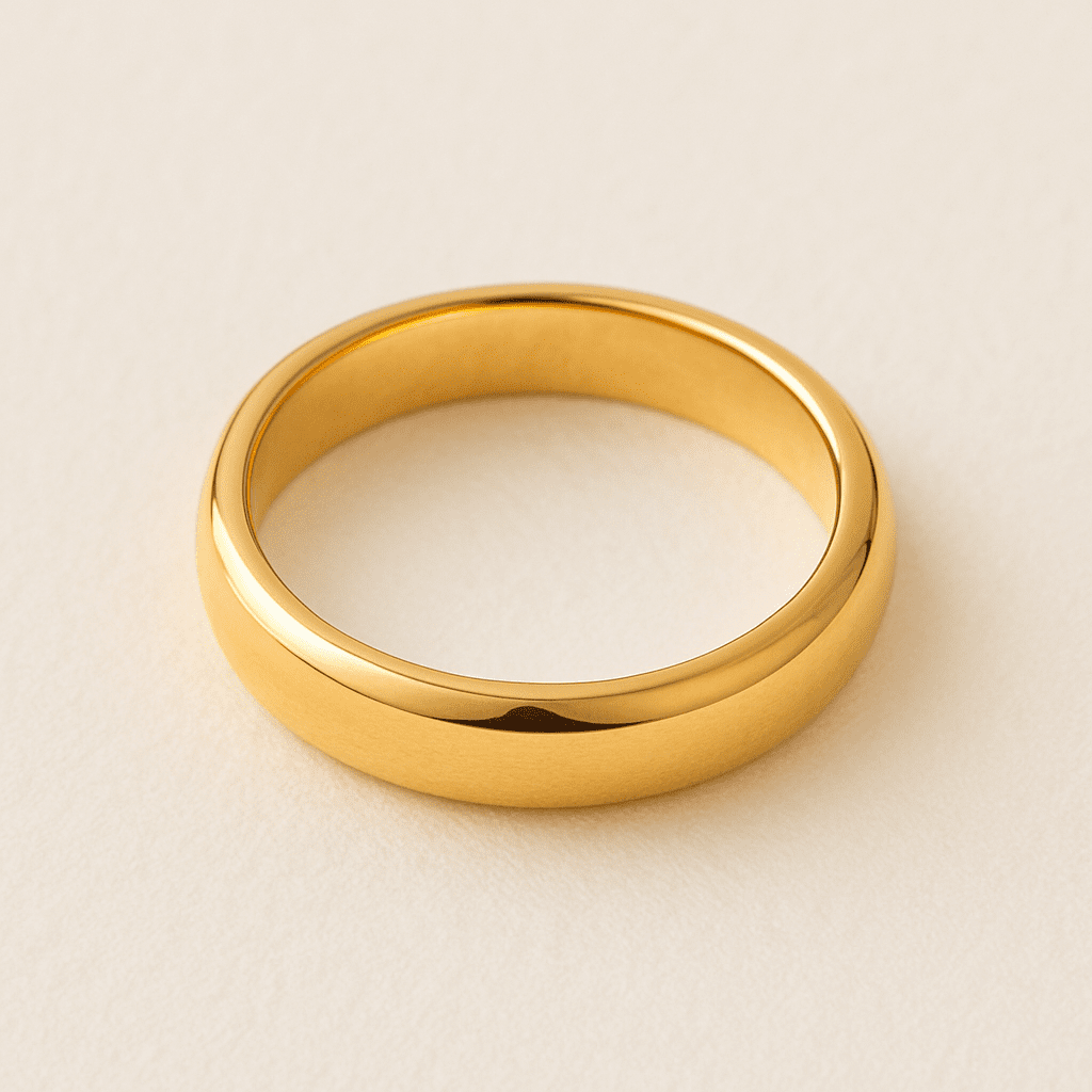 Polished gold ring band with a smooth rounded finish.