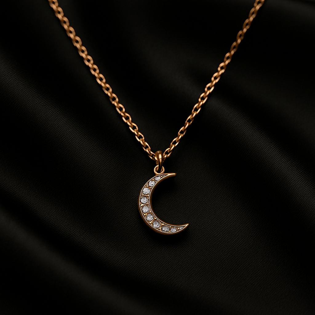 Crescent moon pendant necklace with set diamonds on a fine gold chain