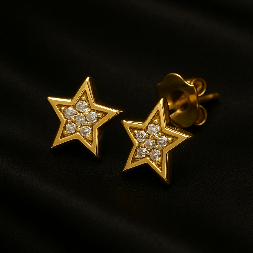 Star-shaped gold stud earrings with a cluster of diamonds at the center
