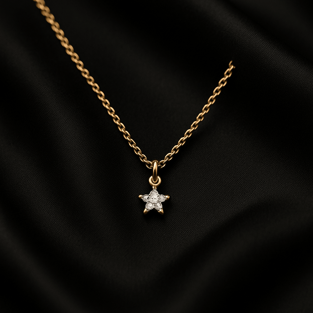Petite star-shaped pendant with inset diamonds on a fine gold chain